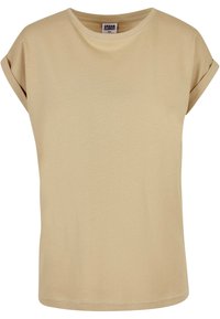 Beige kortärmad t-shirt i bomull med rullade ärmslut och rund halsringning, etikett med texten "Urban Classics XS" inuti kragen.