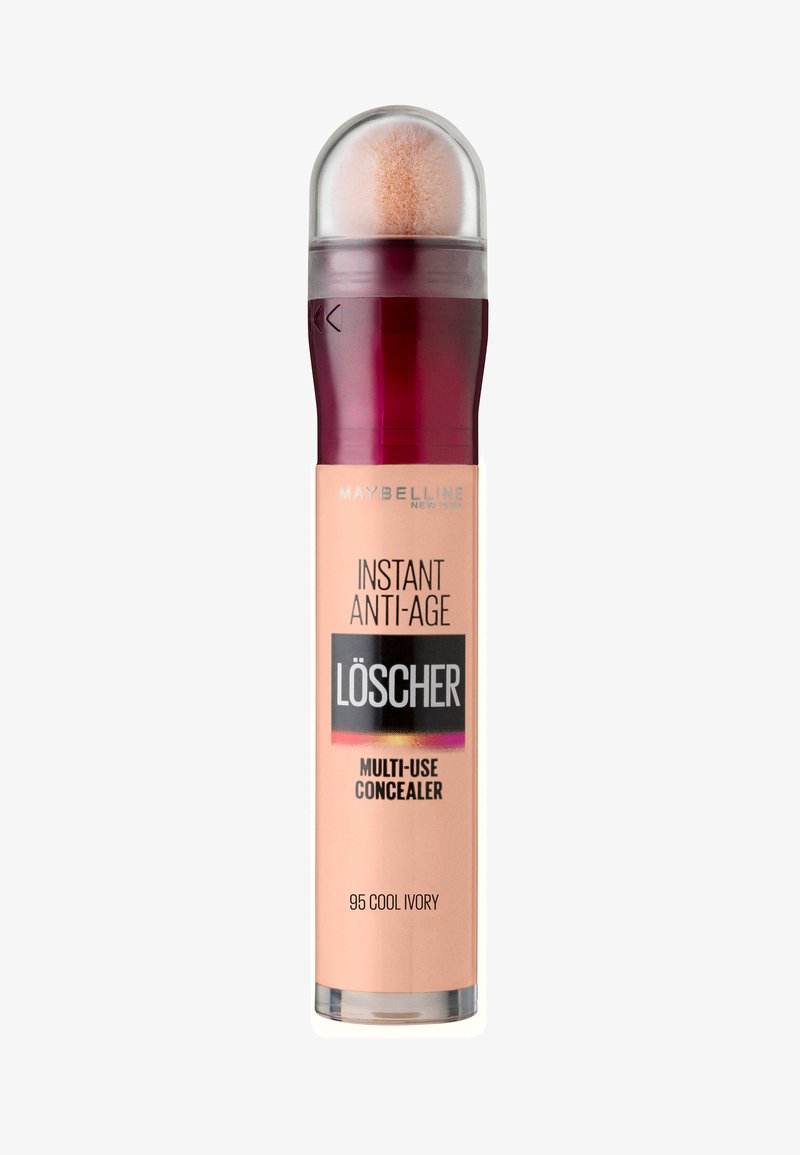 Correcteur Multi-Usage Instant Anti-Age de Maybelline en 95 Cool Ivory. Dispose d'un applicateur rond, d'un capuchon transparent et d'un design dégradé violet et rose.