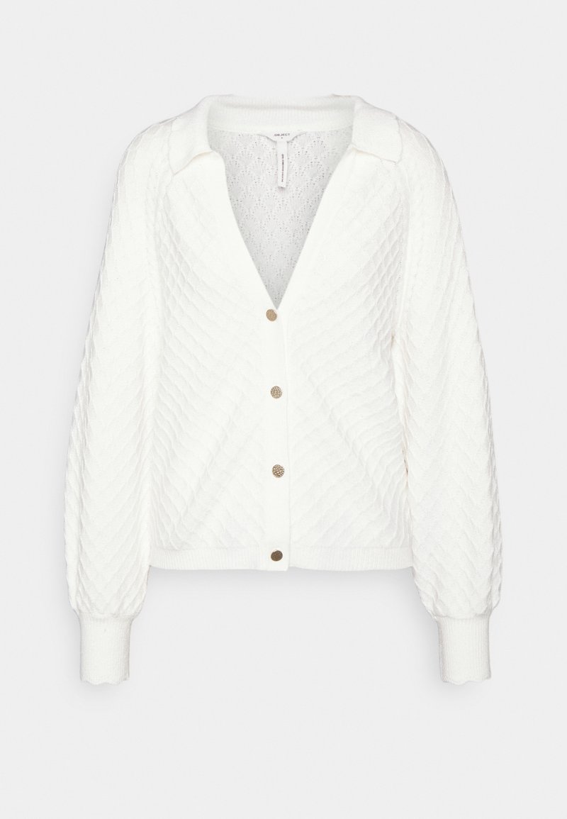 Cardigan en maille blanche avec motif losange, boutons dorés, col et longues manches à poignets.