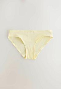 Slip bikini en coton jaune clair pour femme avec un petit nœud décoratif au centre de la ceinture avant sur fond blanc.