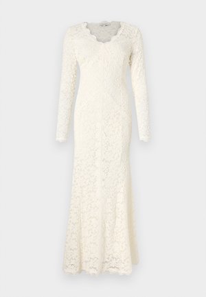 Abito in pizzo avorio a maniche lunghe con scollatura a V ondulata, motivo floreale e una silhouette aderente che si allarga all'orlo.