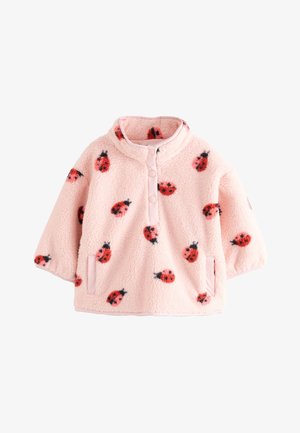 Rosa Fleece-Pullover mit Stehkragen, vorderen Druckknöpfen, Seitentaschen und einem roten und schwarzen Marienkäfermuster.