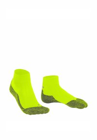 Neon-gelbe Sportsocken mit einem gerippten Bündchen, strukturiertem grauen Fersen- und Zehenbereich für besseren Halt und einer engen Passform, die auf Komfort und Leistung ausgelegt ist.