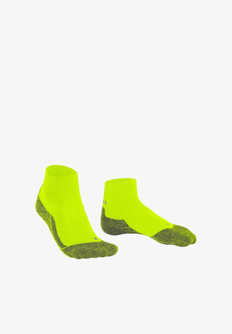 Neon-gelbe Sportsocken mit einem gerippten Bündchen, strukturiertem grauen Fersen- und Zehenbereich für besseren Halt und einer engen Passform, die auf Komfort und Leistung ausgelegt ist.