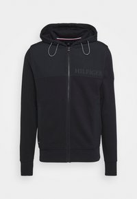 Sudadera con capucha negra con cremallera, panel contrastante, cordones y logo bordado "HILFIGER"; cuenta con un bolsillo tipo canguro y puños acanalados.