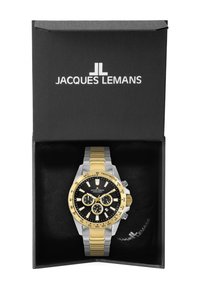 Chronografur med sort urskive, sølv- og guldfarvet rustfrit stål kasse, gule accenter, tre subure og tachymeter bezel i en sort æske.