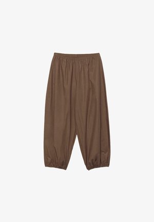 Pantalon marron à coupe ample avec taille élastique et poignets élastiques aux chevilles, fabriqué en tissu léger.