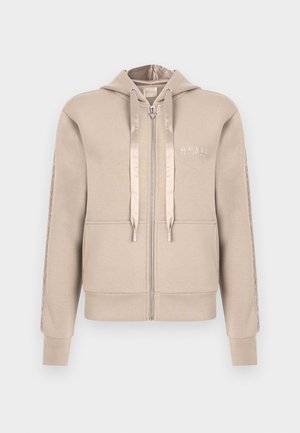Beige zip-up hoodie with a drawstring hood, front pockets, and textured detailing along the sleeves. Embroidered logo on the chest.