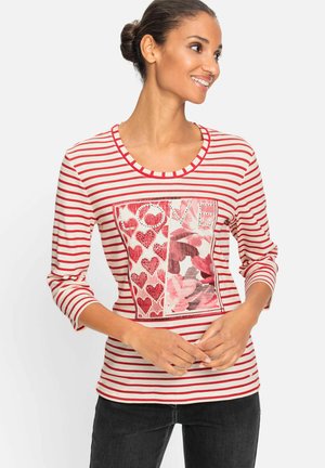 Red and white striped long-sleeve T-shirt with a heart-patterned graphic, round neckline, and soft fabric texture.