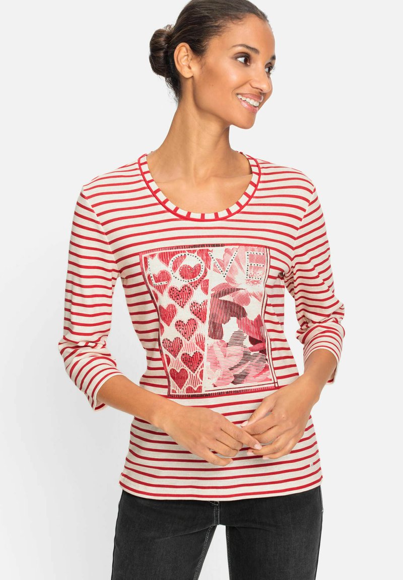 Red and white striped long-sleeve T-shirt with a heart-patterned graphic, round neckline, and soft fabric texture.
