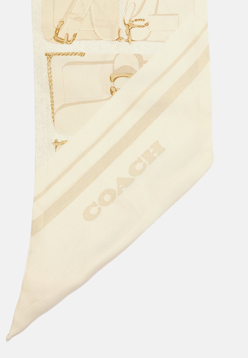 Écharpe en soie couleur crème arborant des illustrations de sacs à main subtils et des accents dorés. Comprend le logo Coach dans un ton beige assorti.