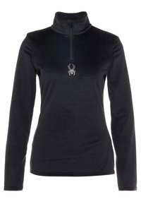 Sudadera de forro polar negra con cuello alto y media cremallera. Presenta un logo de araña hecho de strass en la parte frontal. Manga larga, textura suave.