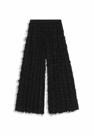 Pantaloni neri a gamba larga in tessuto testurizzato con dettagli stratificati e sfrangiati e una cintura liscia. Il design complessivo è fluido e leggero.