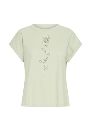 Svetlo zelena majica s kratkimi rokavi z zavihanimi rokavi in črno neprekinjeno linijsko risbo vrtnice, ki je postavljena na sredino sprednjega dela.