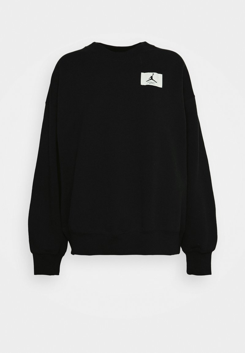 Sweat-shirt noir à manches longues avec col rond, poignets côtelés et petit patch logo blanc sur la poitrine gauche.