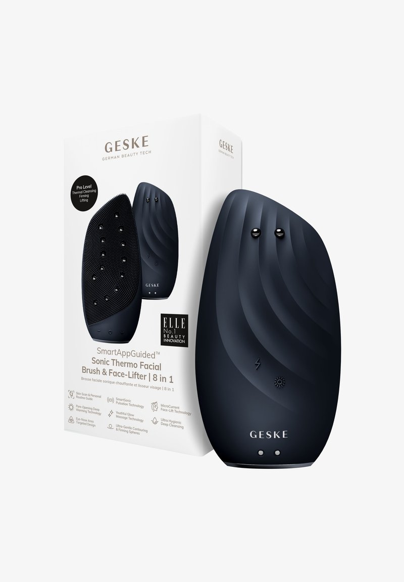 Sonic ansiktsborste i mattsvart med en böjd form, strukturerad yta, två knappar och förpackning med vit och svart text.