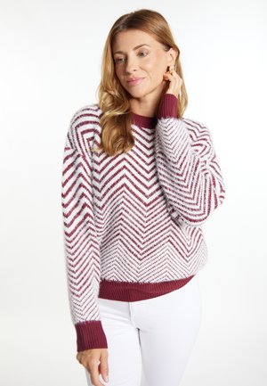 Maglione a zigzag maroon e bianco con collo a girocoso e polsini a costine. Realizzato in morbido tessuto testurizzato. Design cropped con maniche lunghe.