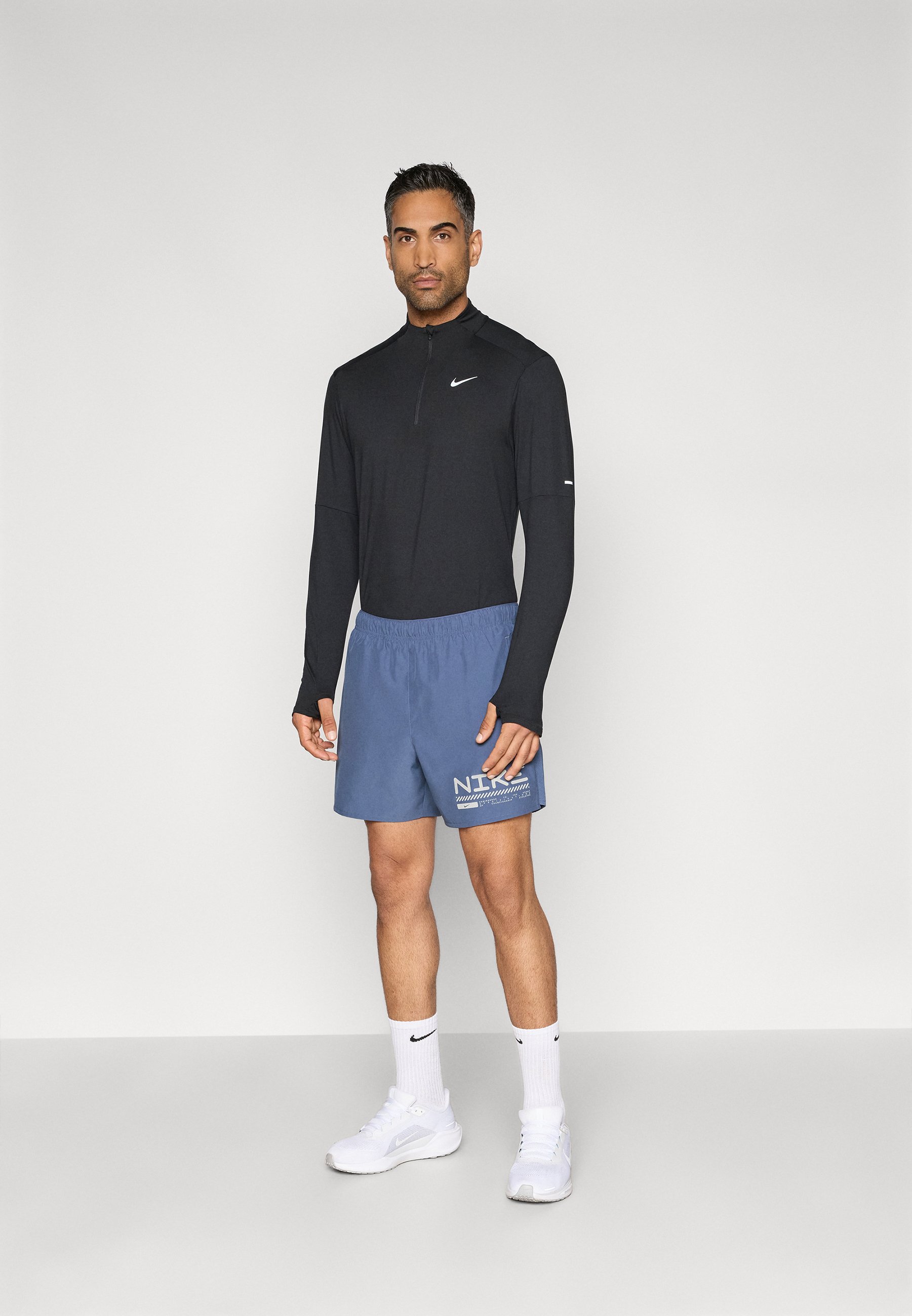 blue nike shorts and top