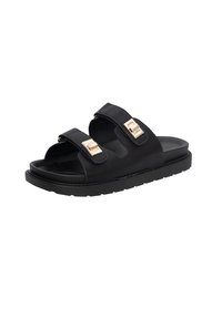 Des sandales noires à glissière avec deux brides réglables, dotées de boucles de couleur or. La semelle est texturée pour une meilleure adhérence et offre un design plat.