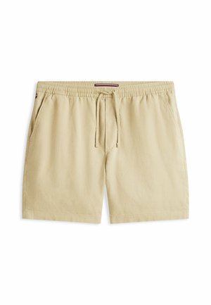 Beige vrijetijdsshorts met elastische tailleband en trekkoord, voorzakken en een klein logodetail in het midden.
