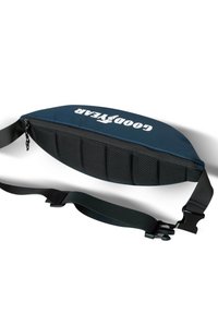 Blue sling bag with mesh paneling, zip closure, padded interior, adjustable strap, and "GOOD YEAR" logo prominently displayed.