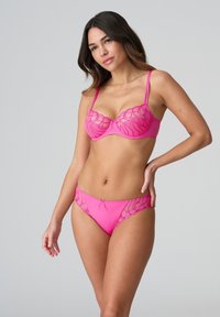 Pink lingerie set featuring a balconette bra with lace detailing and matching brief. Both have a smooth texture and delicate accents.