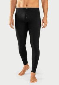 Mustad mustad legginsid sobiva disainiga, millel on logo ja nupuga vöökoht ning soonikkoes pahkluud. Valmistatud pehmest kangast.