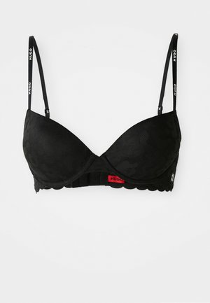 Svart behå med mönstrad tyg; formade kupor, justerbara band med "HUGO"-etikett och en scalloped kant. Innehåller en röd etikett på bandet.