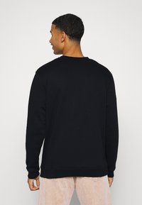 Santa Cruz STRANGE OVAL STRIP CREW UNISEX - Camisola - black