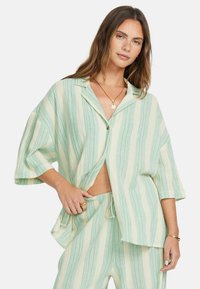 SIDE - MIT KURZEN ÄRMELN - Strandaccessoar  - ign green