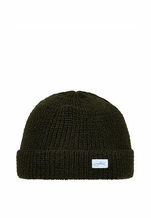 Dark green knitted beanie hat with folded brim and small white rectangular label on the front.