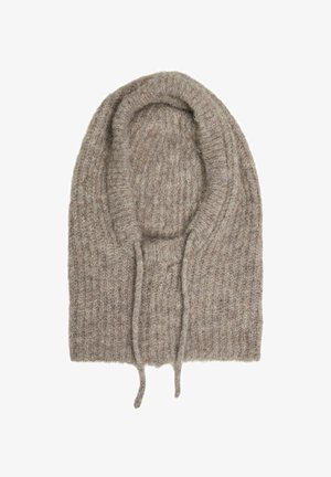 Strik oversized hue i lysebrun, med ribbet tekstur og snore til justering af pasform. Blødt og hyggeligt materiale.