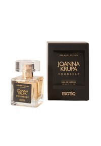 Przezroczysta szklana butelka na perfumy o prostokątnym kształcie, ze złotymi akcentami i wysoką nakrętką, obok czarnego pudełka ze złotym napisem. 30 mL.