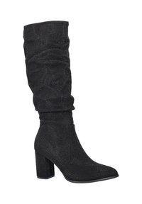Black mid-calf suede boot with pointed toe, block heel, and small shiny studs covering the entire surface.