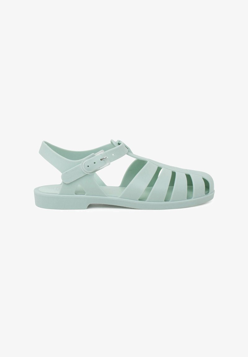 Heledad hele rohelised plastikust sandaalid väljajoonistatud disainiga, pahkluu rihm, reguleeritav klamber ja lamedat talla. Sobivad sooja ilma jaoks.