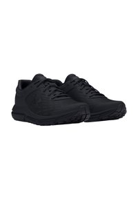 Chaussures de sport noires en matériau synthétique, avec une surface texturée, un design à lacets et une semelle à motif pour une meilleure adhérence.