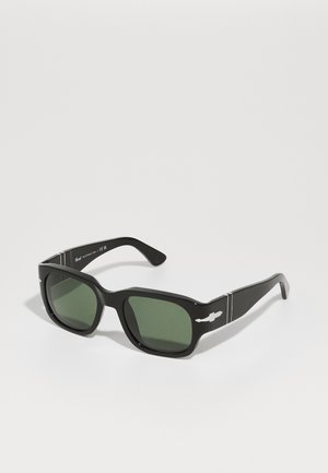 Black rectangular sunglasses with green lenses, featuring metallic accents and a sleek, glossy finish. Sturdy frames with defined edges.