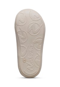 Semelle en caoutchouc beige clair présentant une surface texturée avec des motifs circulaires et un logo "Naturino". Taille indiquée comme "20".