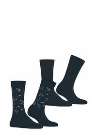 Zestaw granatowych skarpetek składający się z dwóch par wzorowanych i dwóch par gładkich. Jedna para ma kwiatowy wzór; wszystkie mają prążkowaną strukturę i miękką tkaninę.