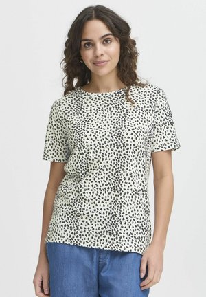 T-shirt a maniche corte color crema con motivo leopardato nero, dotato di scollo rotondo e vestibilità comoda. Tessuto morbido e traspirante.