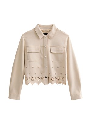 Veste beige courte avec col, boutons-pression, deux poches poitrine à rabat et motif floral découpé le long de l'ourlet festonné.