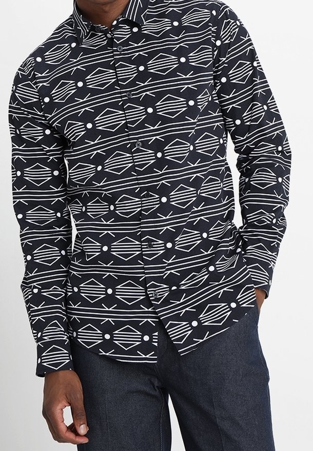 Zwarte overhemd met knopen, voorzien van een geometrisch wit patroon van diamanten, lijnen en cirkels. Gemaakt van katoen met een standaard kraag en lange mouwen.