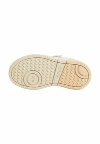 Suola in gomma per sneakers, con un motivo testurizzato che presenta scanalature e cerchi. La combinazione di colori è beige chiaro con una sezione color sabbia.