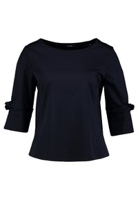 Marinblus med trekvartsärmar, med rundhalsning och knytningar på ärmarna. Tillverkad av mjukt, lätt material.