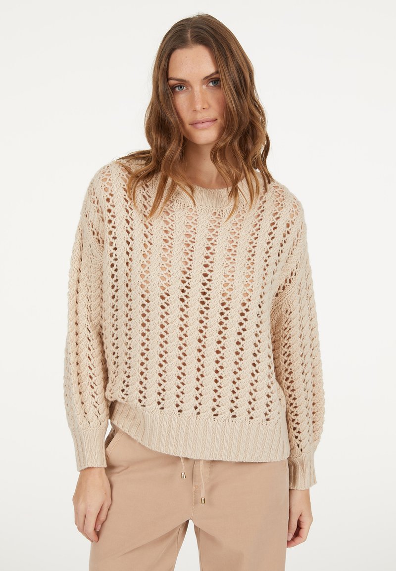 Beiger Strickpullover mit Lochmuster, rundem Halsausschnitt und gerippten Bündchen. Verfügt über eine lockere Passform und ein strukturiertes Muster.