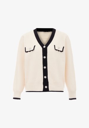 Cardigan crem cu decolteu în V, bordură neagră și două buzunare frontale. Prezintă nasturi decorativi cu accente florale și manșete cu nervuri.