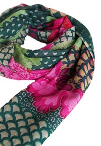 Colorful floral scarf in green, pink, and beige; made of soft fabric with intricate patterns and textures, featuring large flowers and scales.