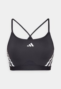 Črna športna modrc z naramnicami v obliki križa, z belo črtami in logotipom Adidas na sprednji strani. Narejen iz elastičnega, gladkega materiala.