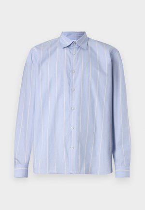 Hele sinine pika varrukaga särk, millel on vertikaalsed valged ja kollased triibud. Omab klassikalist kraed ja täisnöörimist. Pehme kangakaitse.