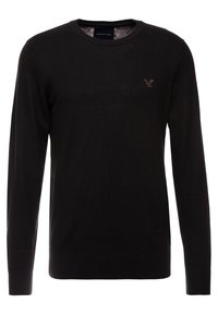 Black knit sweater featuring a crew neckline, long sleeves, and ribbed hems. Small eagle logo in a slightly darker shade on the chest.